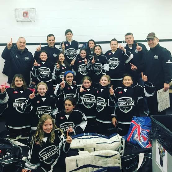 North York Storm players and coaches celebrating together