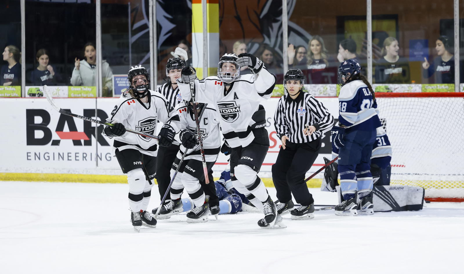 North York Storm players celebrating beside the net